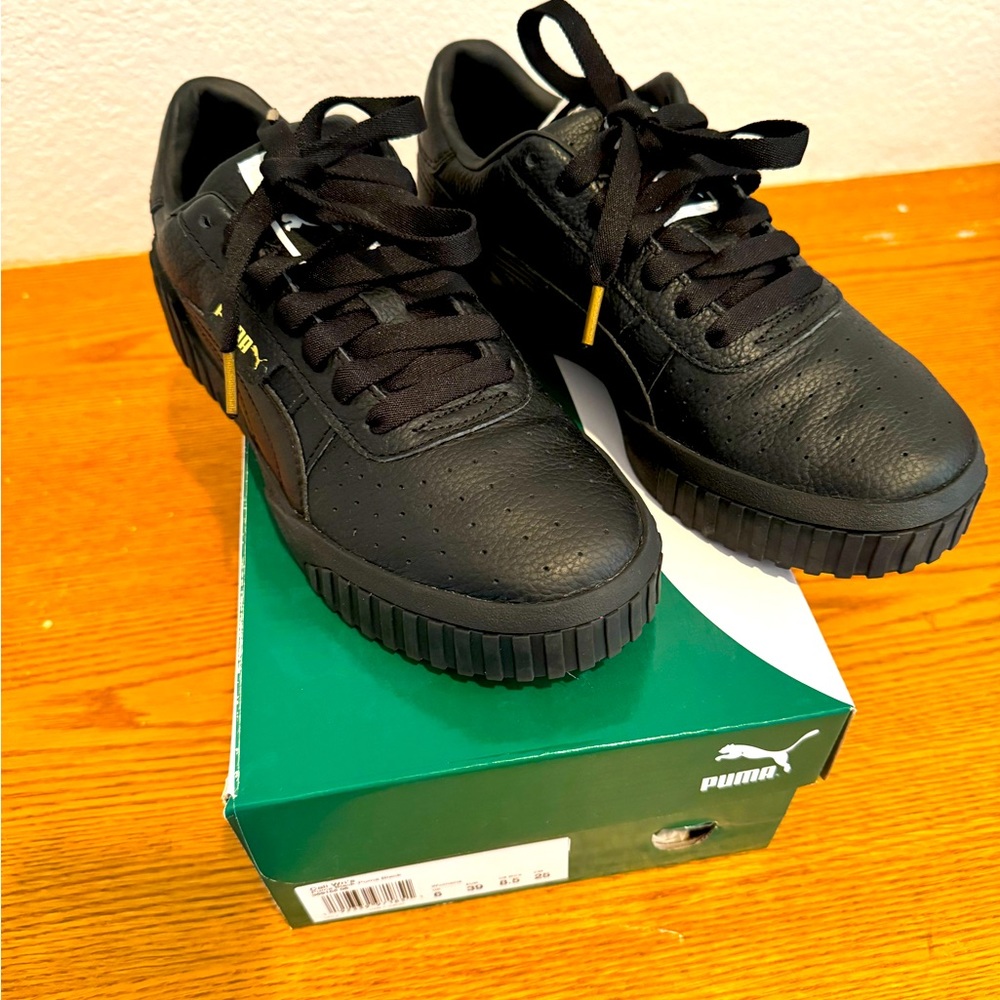 Puma Black Leather Platform Sneakers with Gold Accents